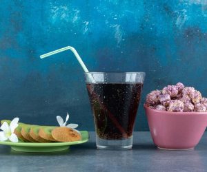 snack-set-sliced-kiwis-glass-cola-bowl-popcorn-candy-blue_114579-60610