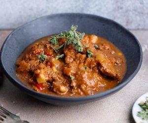 tasty-stew-goulash-with-vegetables-served-bowl_1220-7673